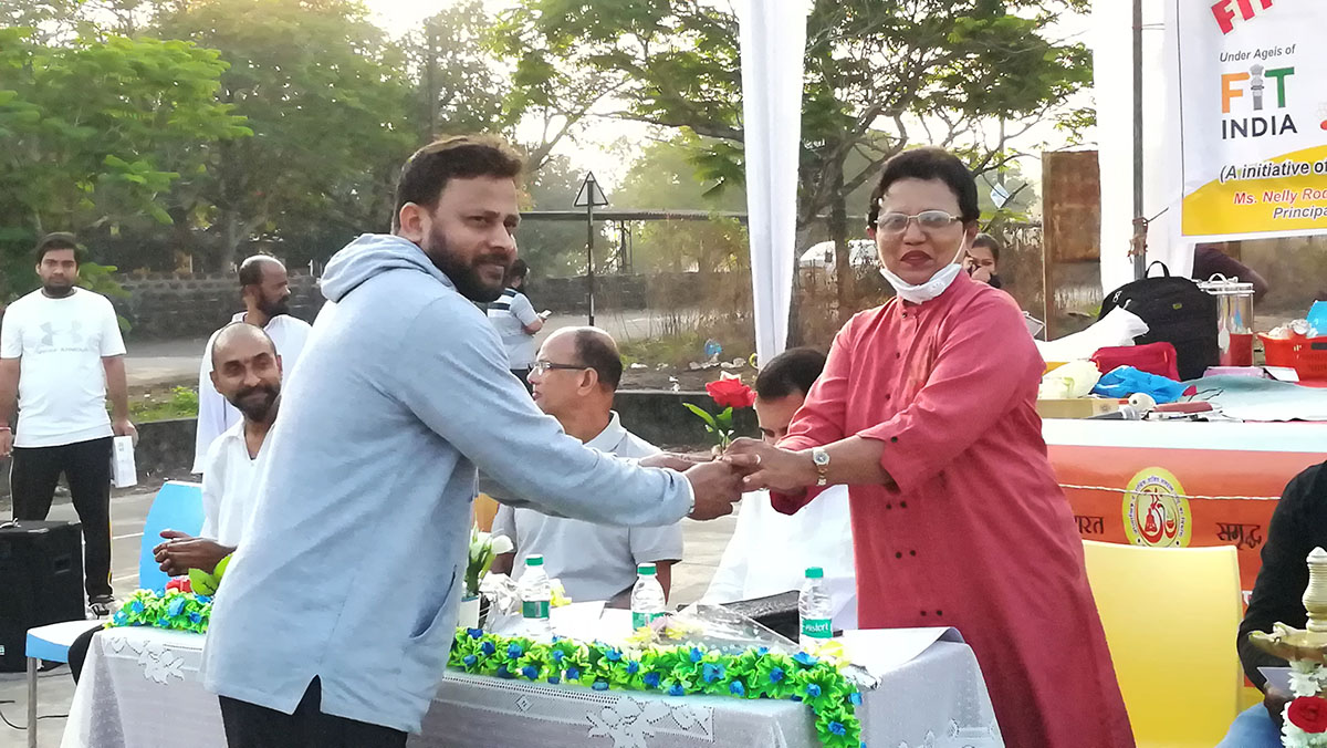 Principal Nelly Rodrigues being felicitated.