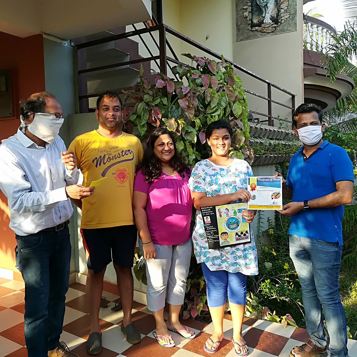 Velusha Basilia Rodrigues receiving award